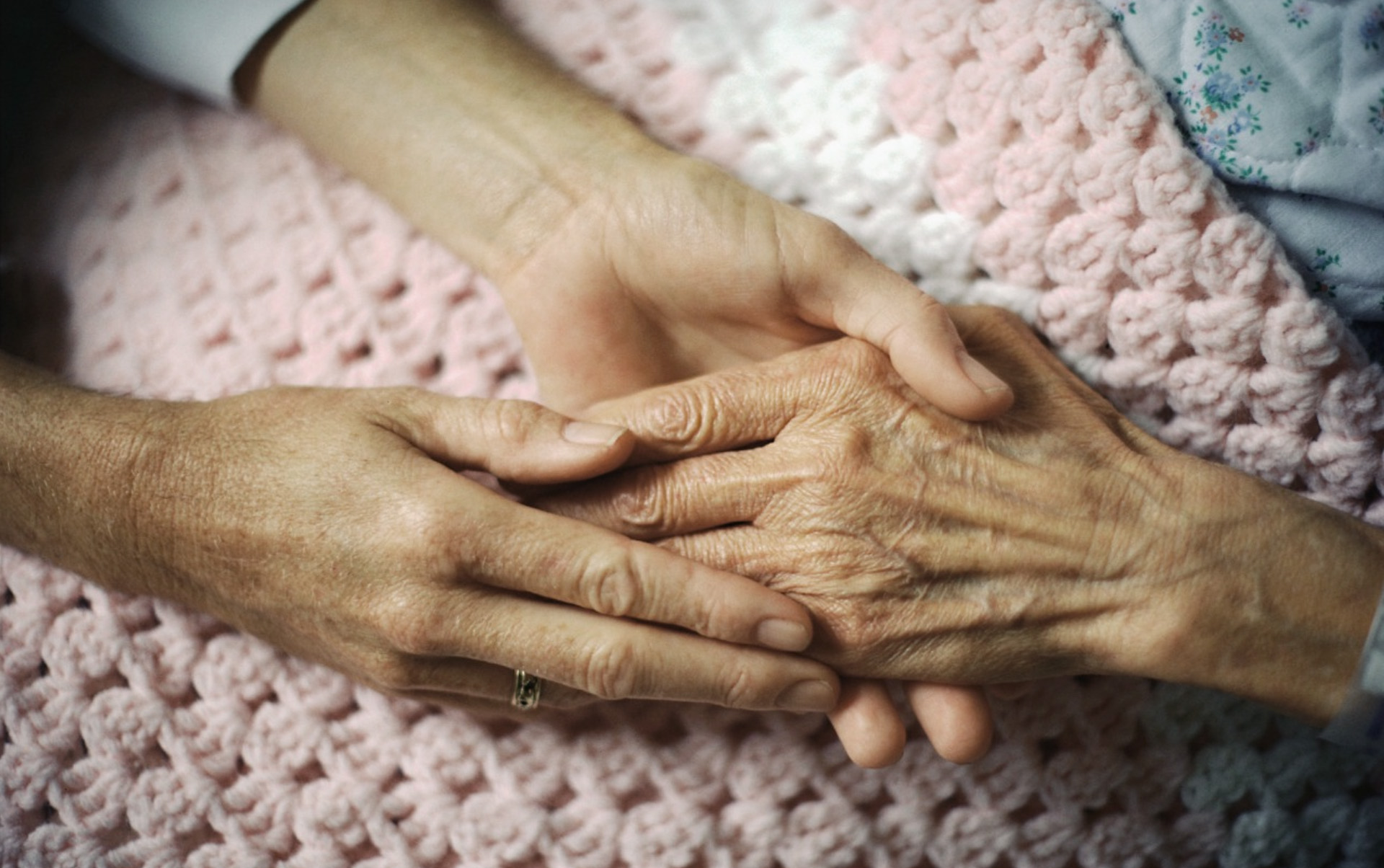 holding hand of elderly patient