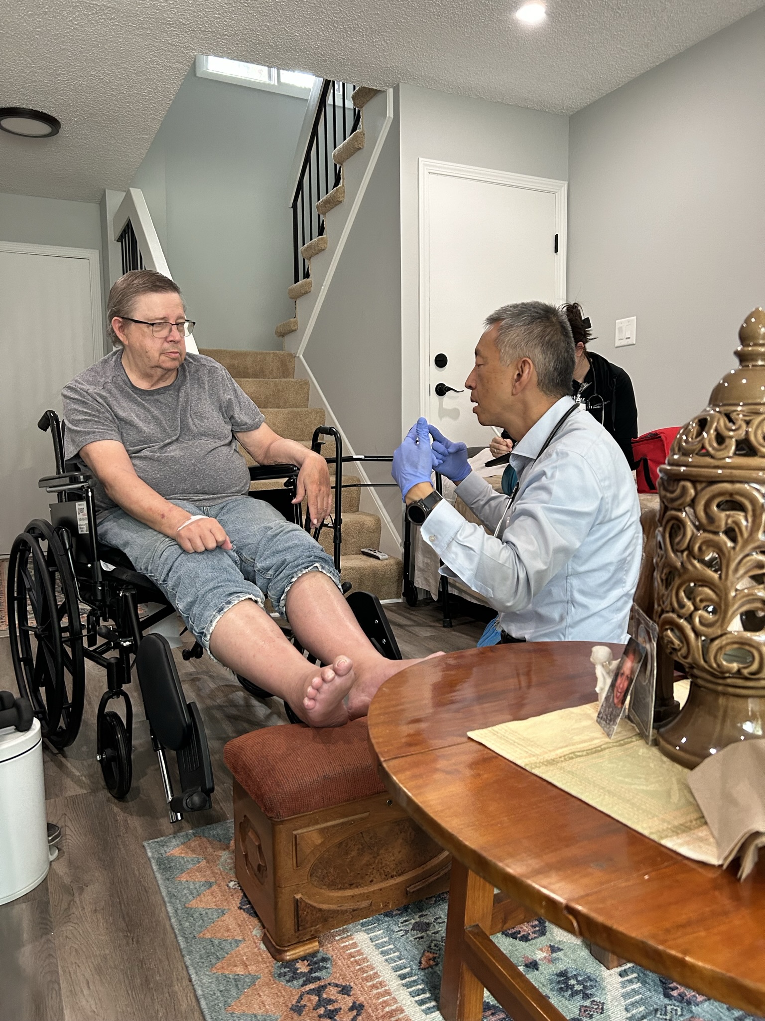 Doctor with man in wheelchair